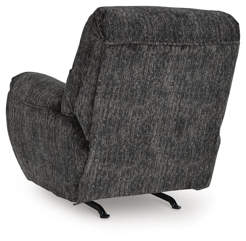 Ashley Furniture Stayfish recliner with plush fabric upholstery and padded armrests, shown from the back in a relaxed seating position.