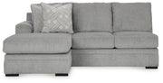 Ashley Furniture Casselbury 2-piece sectional with chaise showing plush fabric, wide armrests, and chaise lounge in a modern living room setting.