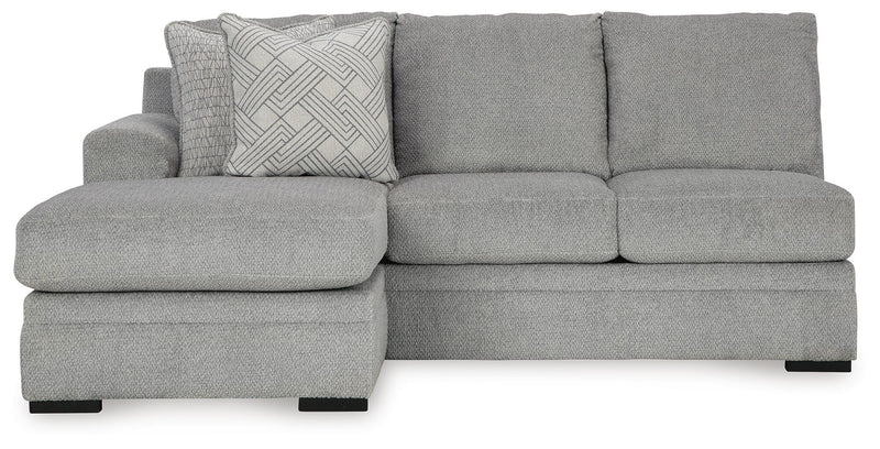 Ashley Furniture Casselbury 2-piece sectional with chaise showing plush fabric, wide armrests, and chaise lounge in a modern living room setting.
