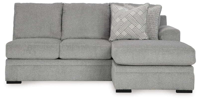 Ashley Furniture Casselbury 2-piece sectional with chaise showing plush cushions and neutral fabric in a modern living room setting.