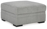 Ashley Furniture Casselbury living room set with sofa and armchair, featuring neutral fabric and modern design, shown from an angle.