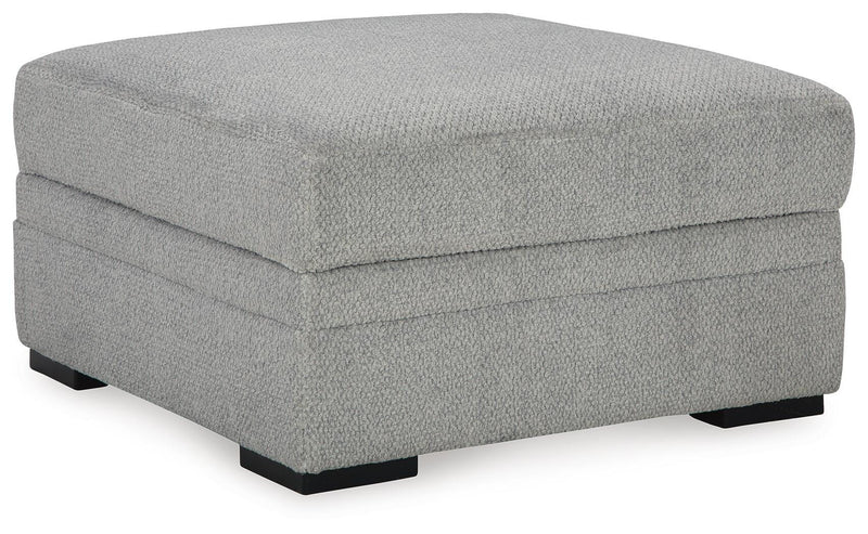 Ashley Furniture Casselbury living room set with sofa and armchair, featuring neutral fabric and modern design, shown from an angle.