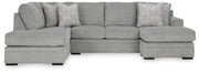 Ashley Furniture Casselbury living room set with sofa and armchair featuring neutral upholstery and wooden legs.