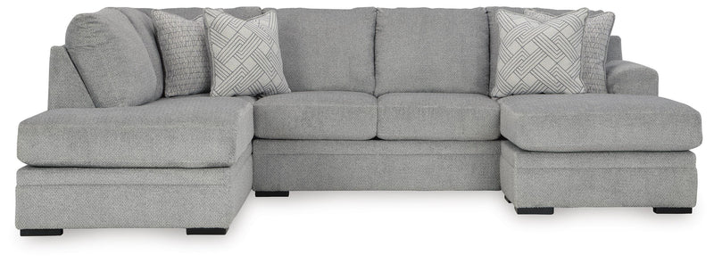 Ashley Furniture Casselbury living room set with sofa and armchair featuring neutral upholstery and wooden legs.