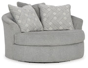 Ashley Furniture Casselbury oversized swivel accent chair with plush upholstery and wide armrests, shown from an angle.