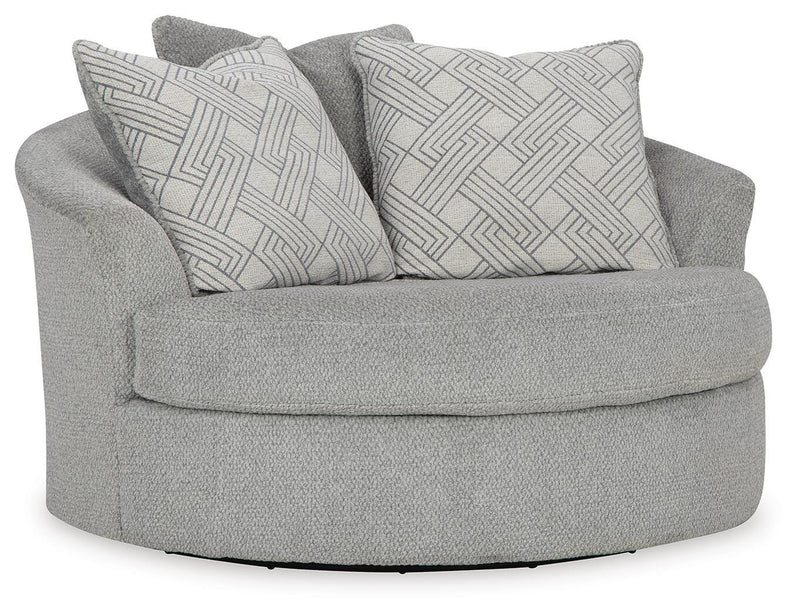 Ashley Furniture Casselbury oversized swivel accent chair with plush upholstery and wide armrests, shown from an angle.