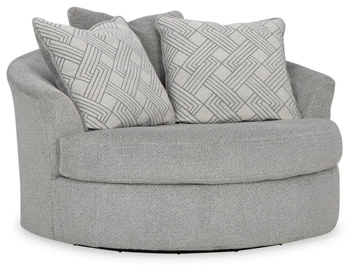 Ashley Furniture Casselbury oversized swivel accent chair with plush upholstery and wide armrests, shown from an angle.