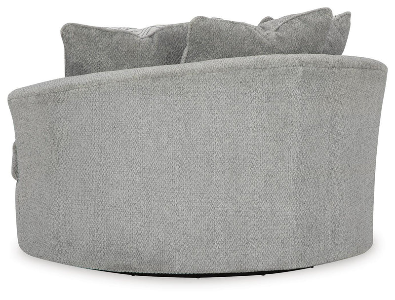 Ashley Furniture Casselbury oversized swivel accent chair with plush upholstery and a rounded back in a stylish living room setting.