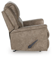 Ashley Furniture Lixtowel recliner with plush upholstery and wooden legs, shown from the side in a modern living room setting.