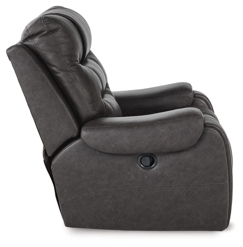 Ashley Furniture Femley recliner with plush cushioning and dark brown upholstery, shown from the side view.