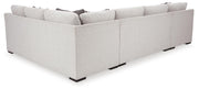 Ashley Furniture Koralynn living room set with a sofa and loveseat, shown from the back in a modern living space.