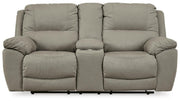 Ashley Furniture Next-Gen Gaucho Reclining Loveseat with Console, shown in a head-on view with plush fabric and built-in cup holders.