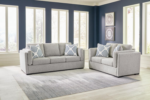 Ashley Furniture Evansley living room set with sofa and loveseat in neutral upholstery, modern design, placed in a stylish living room.