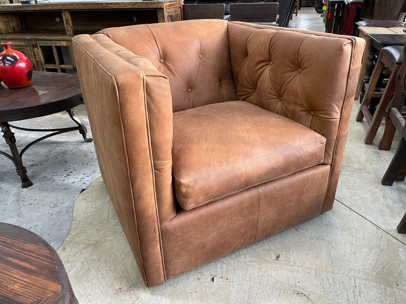 Leather swivel accent chair with tufted upholstery, model 7773L42 by Mayo Furniture, in a stylish, modern design.