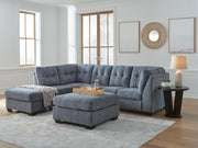 Ashley Furniture Marleton living room set featuring a sofa, loveseat, and armchair with neutral fabric upholstery.