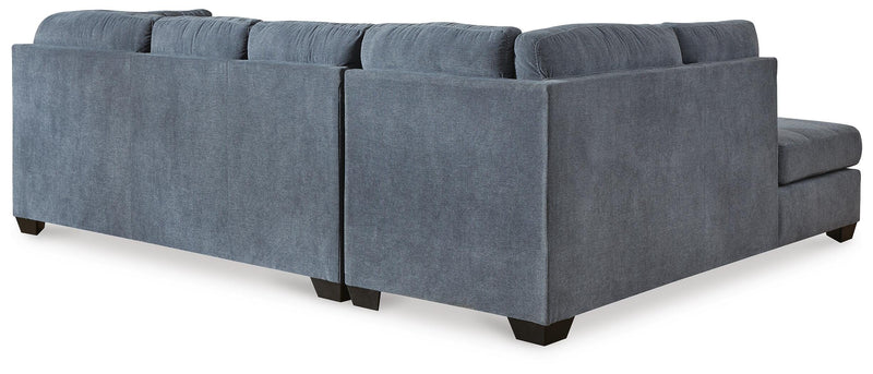 Ashley Furniture Marleton living room set with sofa and armchair, shown from the back with neutral fabric upholstery.