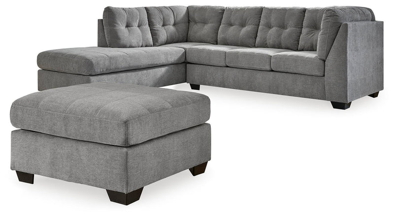 Ashley Furniture Marleton living room set with sofa and armchair in a modern design, featuring neutral upholstery and decorative cushions.