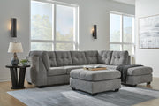 Ashley Furniture Marleton living room set with sofa and armchair, upholstered in neutral fabric, arranged in a cozy living space.