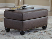 Ashley Furniture Roxmere Ottoman with plush fabric and wooden legs, perfect for living room decor.