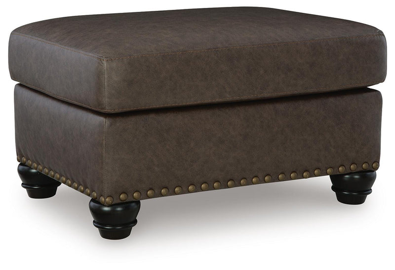 Ashley Furniture Roxmere Ottoman showing a plush upholstered surface and wooden legs, stylish and functional home decor piece.