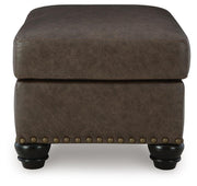 Ashley Furniture Roxmere Ottoman with plush fabric and wooden legs, shown as a stylish living room accent piece.
