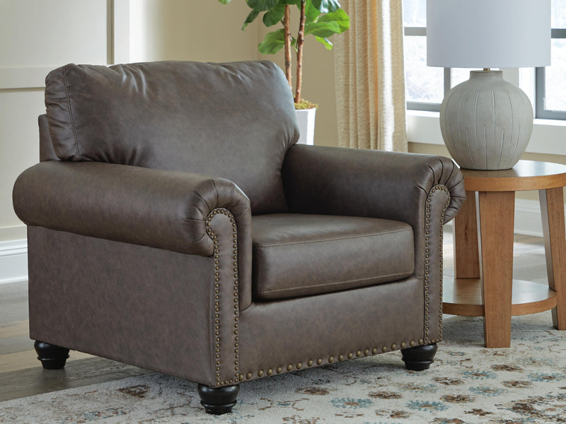 Ashley Furniture Roxmere Chair with dark fabric upholstery and wooden legs, showcasing a modern, comfortable seating design.