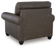 Ashley Furniture Roxmere Chair with plush fabric and cushioned back, shown from the back view in a modern living room setting.