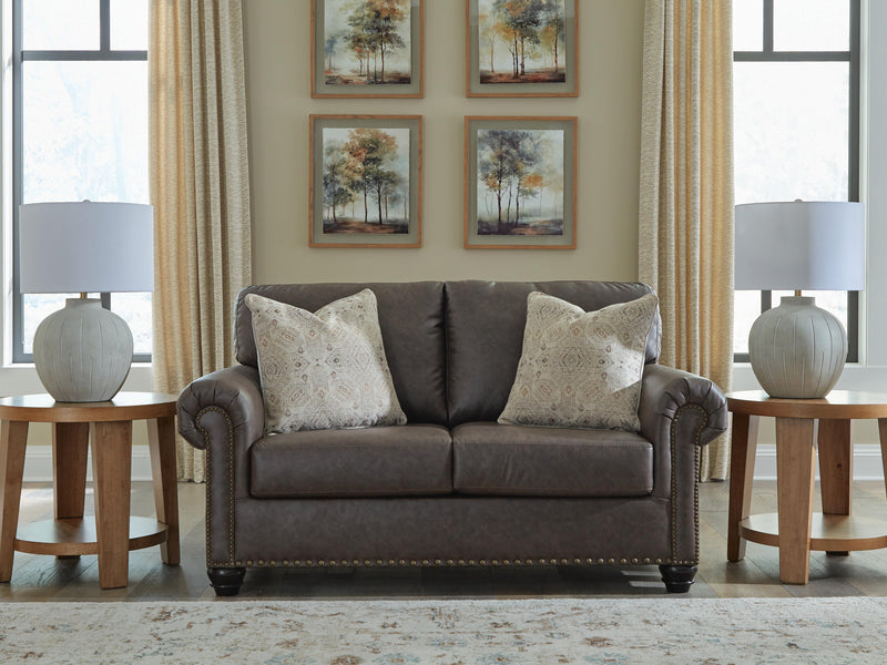 Ashley Furniture Roxmere loveseat with plush fabric and cushioned armrests, perfect for cozy living room seating.