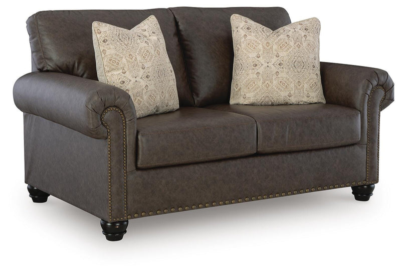 Ashley Furniture Roxmere loveseat with plush fabric and cushioned armrests, shown from an angled view.