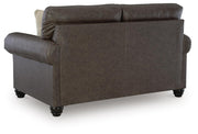 Ashley Furniture Roxmere loveseat with plush fabric and cushioned back, shown from the back angle in the image.