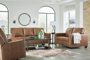 Ashley Furniture Bolsena living room set with sectional sofa, armchair, and coordinated coffee table, in a modern living space.