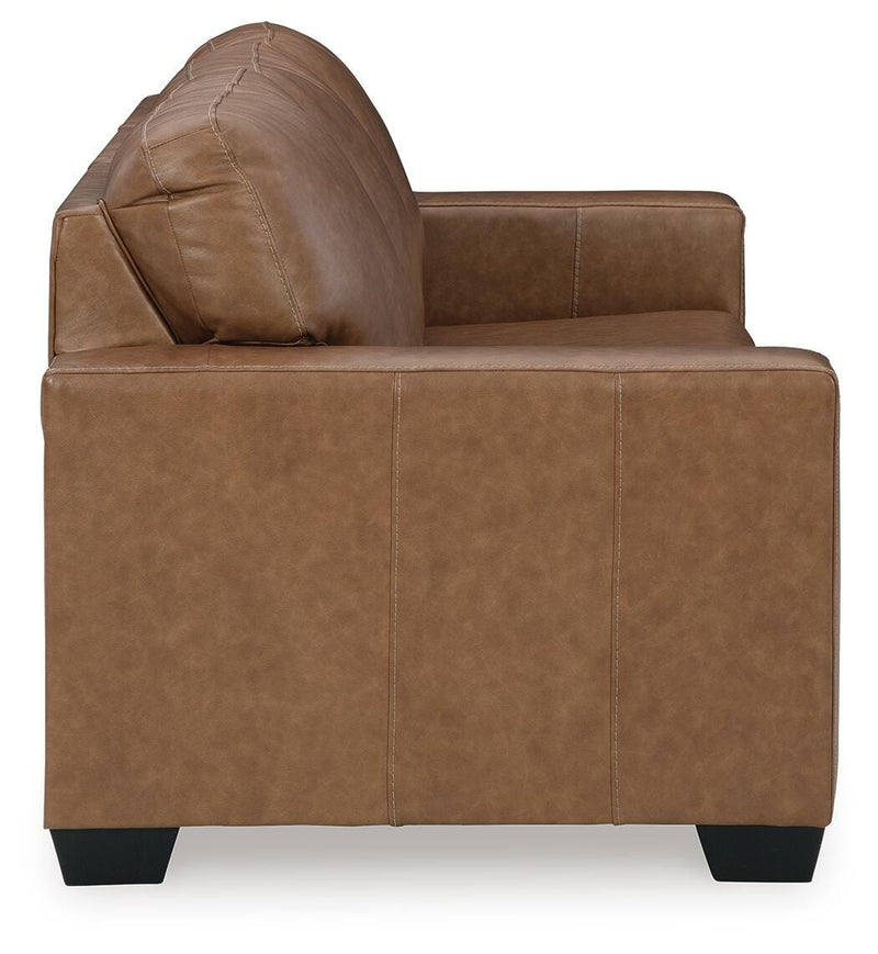 Ashley Furniture Bolsena sofa sleeper with a neutral fabric finish, featuring a fold-out bed and plush cushions.