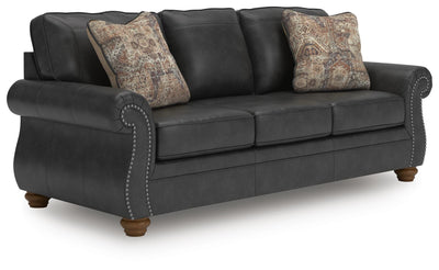 Ashley Furniture Chasemore sofa in a stylish upholstered design, shown from an angled view highlighting its elegant fabric and cushions.