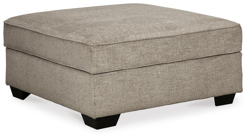 Ashley Furniture Bovarian Living Room Set with sofa and armchair, featuring neutral upholstery and modern design, shown from an angled perspective.