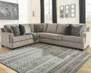 Ashley Furniture Bovarian living room set with sofa, loveseat, and armchair in neutral upholstery, arranged in a stylish seating area.
