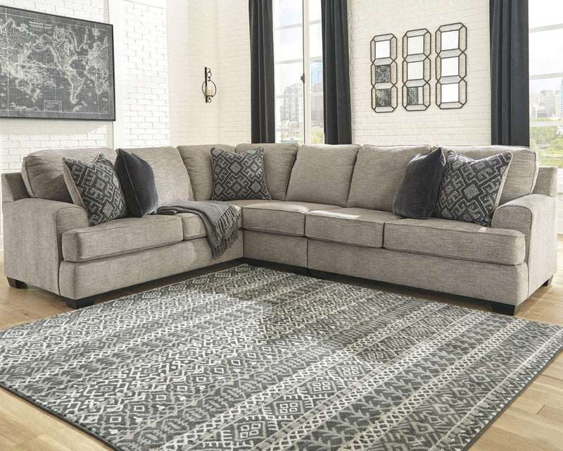 Ashley Furniture Bovarian living room set with sofa, loveseat, and armchair in neutral upholstery, arranged in a stylish seating area.
