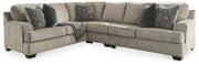 Ashley Furniture Bovarian living room set with sofa, loveseat, and armchair in neutral fabric, arranged in a modern living space.