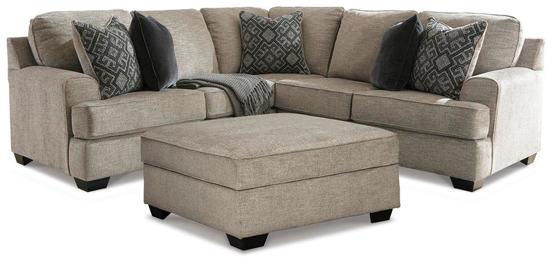 Ashley Furniture Bovarian living room set includes sofa and armchair with neutral fabric upholstery and modern design.