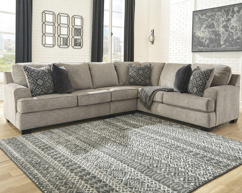 Ashley Furniture Bovarian living room set with sofa, loveseat, and armchair in neutral fabric and wood accents.