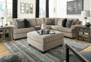 Ashley Furniture Bovarian sectional sofa with plush cushions and neutral fabric, shown with multiple connected sections and modern design.