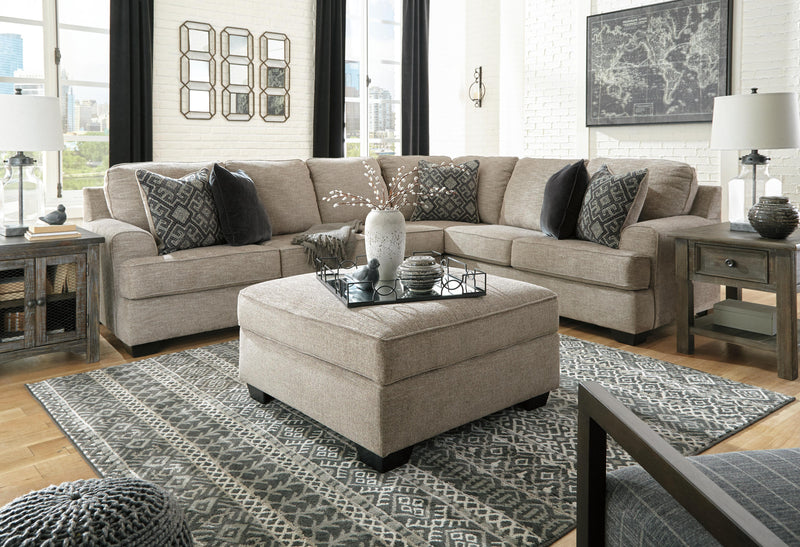 Ashley Furniture Bovarian sectional sofa with plush cushions and neutral fabric, shown with multiple connected sections and modern design.