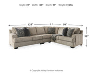 Ashley Bovarian living room set featuring a sofa and armchair with beige upholstery and decorative cushions.