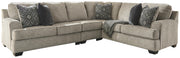 Ashley Furniture Bovarian living room set with sofa, loveseat, and armchair in neutral upholstery, arranged in a modern living space.