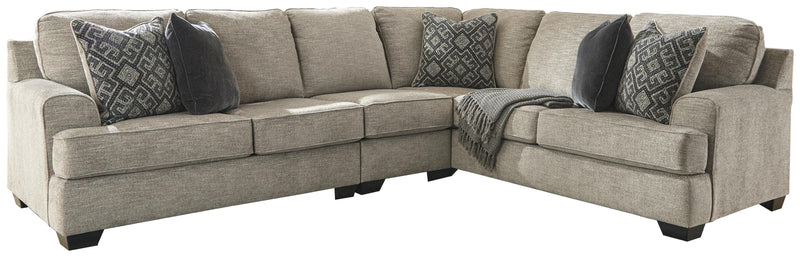 Ashley Furniture Bovarian living room set with sofa, loveseat, and armchair in neutral upholstery, arranged in a modern living space.