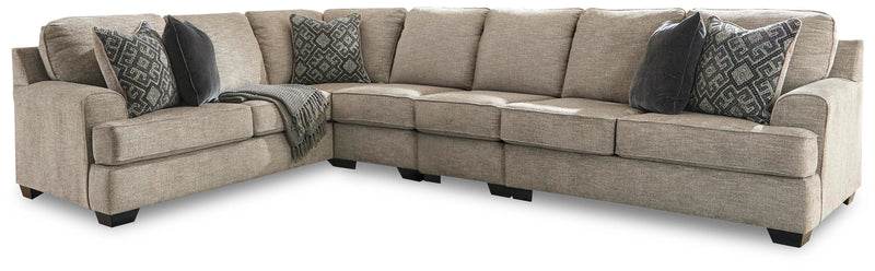 Ashley Furniture Bovarian living room set with sofa and loveseat, featuring neutral upholstery and wooden legs.