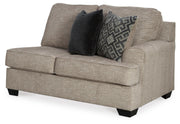 Ashley Furniture Bovarian living room set featuring a sofa, loveseat, and armchair with neutral upholstery and modern design.