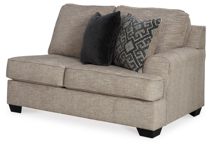 Ashley Furniture Bovarian living room set featuring a sofa, loveseat, and armchair with neutral upholstery and modern design.