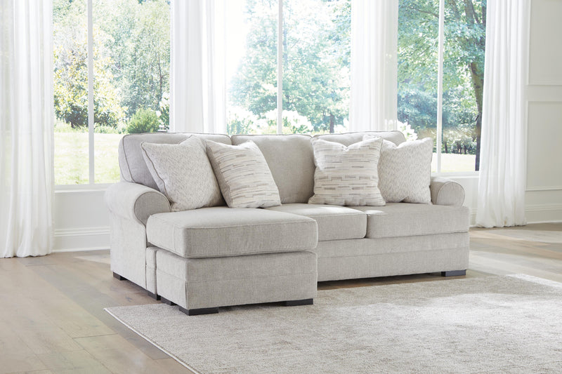 Ashley Furniture Eastonbridge living room set with sofa and armchair, featuring neutral fabric upholstery and wooden legs.