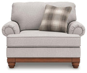 Ashley Furniture Clearbrooke living room set with sofa and armchair, upholstered in light fabric, arranged in a modern living space.