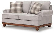 Ashley Furniture Clearbrooke living room set with sofa and armchair, shown from an angled view in a modern living space.